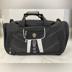 Calpak black canvas multi-pocket dual strap duffel bag travel luggage gym